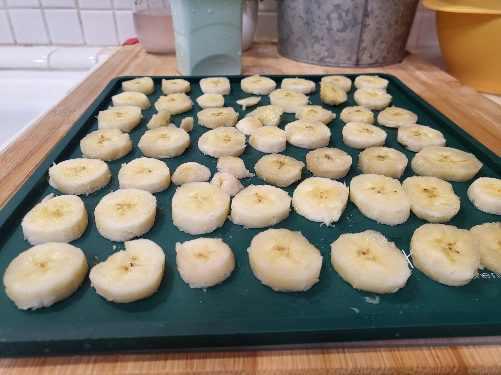 sliced bananas on a silicone dehydrating mat